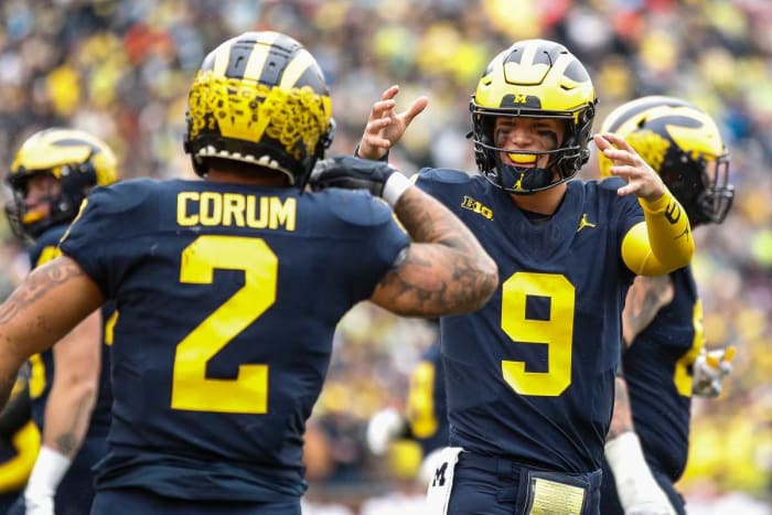 J.J. McCarthy celebrates a touchdown against Indiana scored by running back Blake Corum